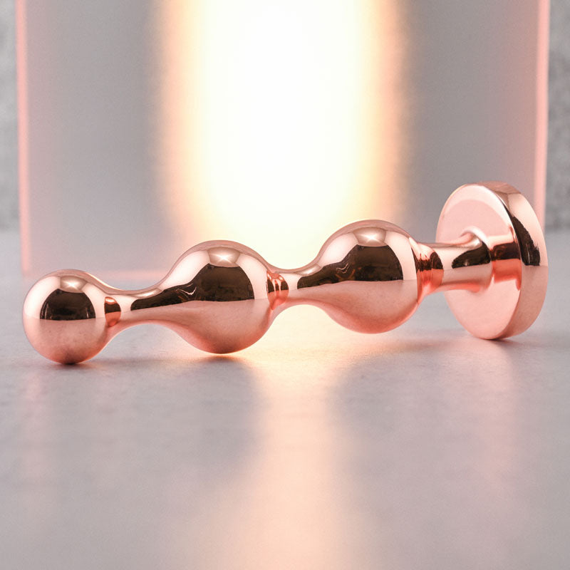 Gender X GOLD DIGGER Large - Rose Gold Large Butt Plug with Black Gem Base